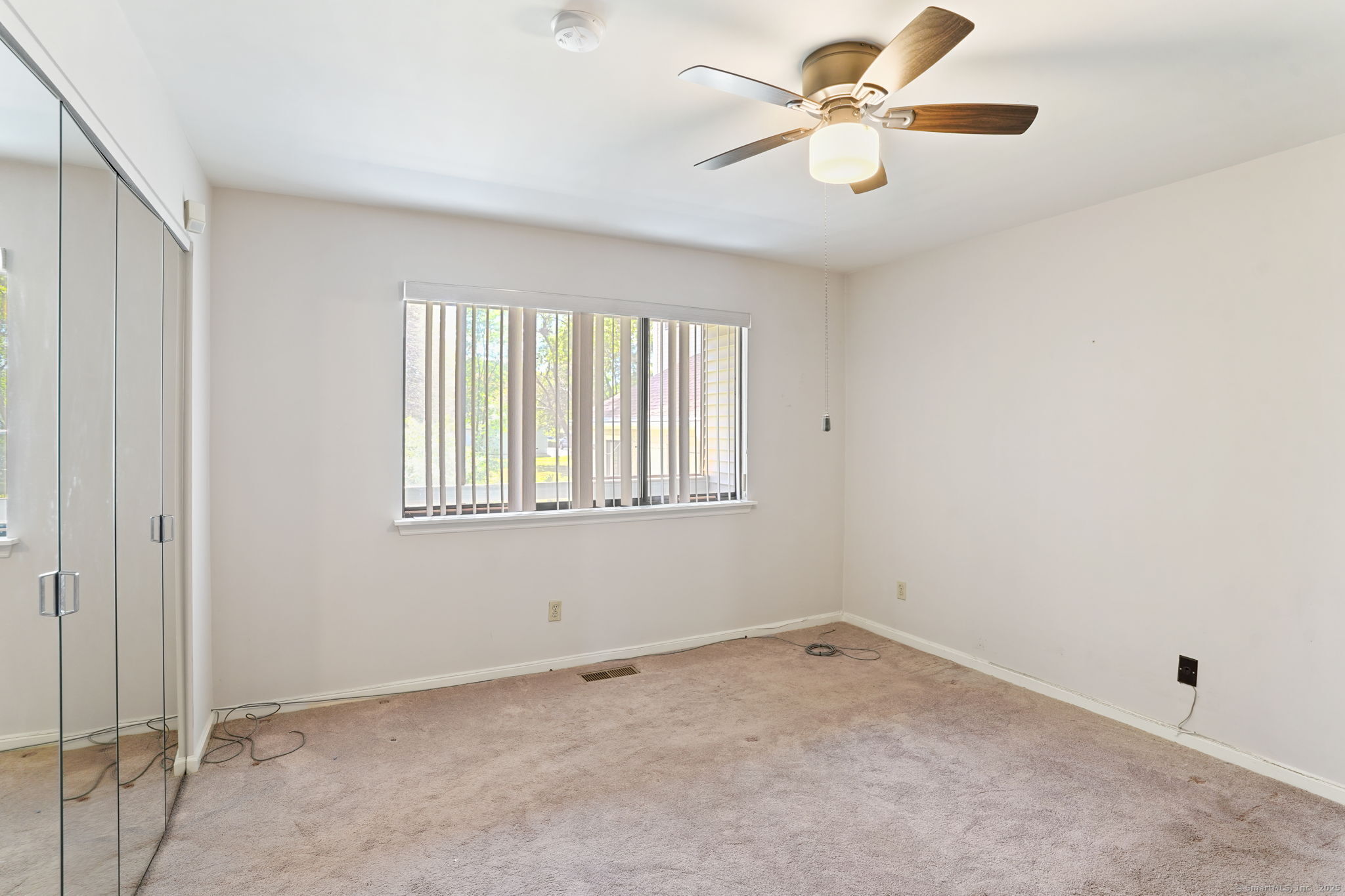 81 Lance Circle, Unit 81 Bridgeport, CT 06606 - Photo 11 of 24 a view of an empty room with a window