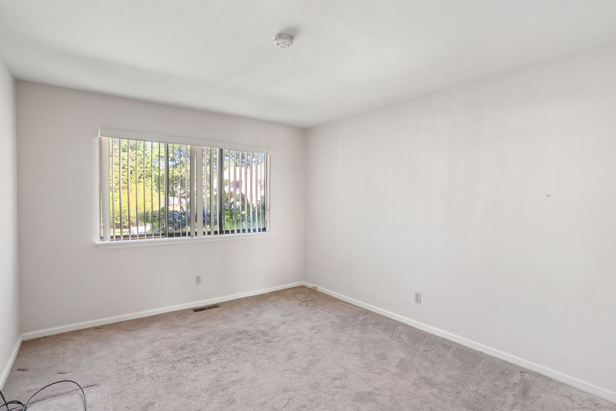 81 Lance Circle, Unit 81 Bridgeport, CT 06606 - Photo 16 of 24 an empty room with windows