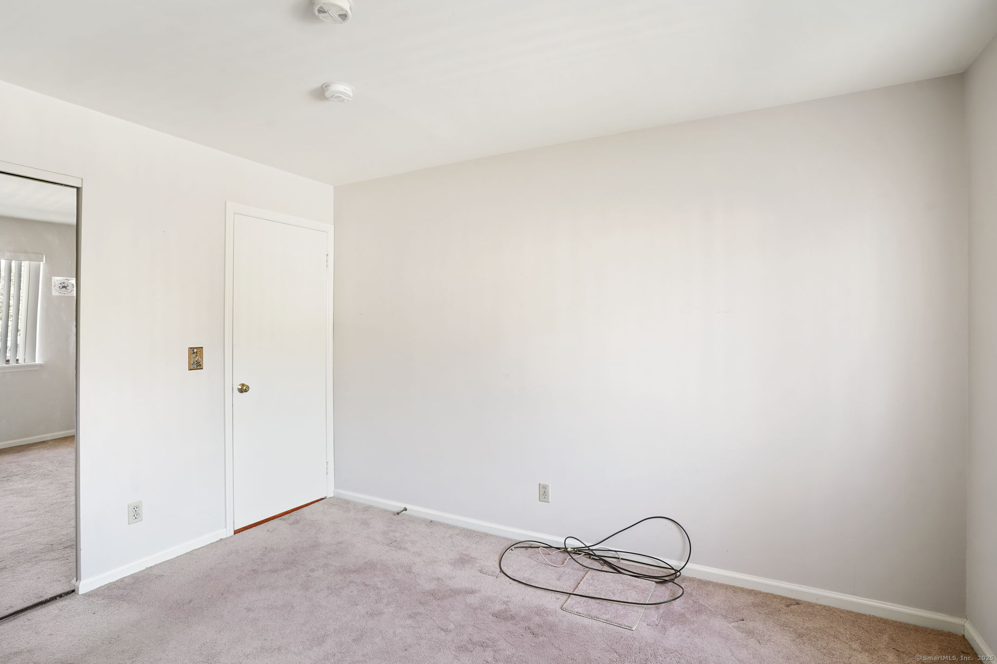 81 Lance Circle, Unit 81 Bridgeport, CT 06606 - Photo 17 of 24 a view of a room with rack on the wall