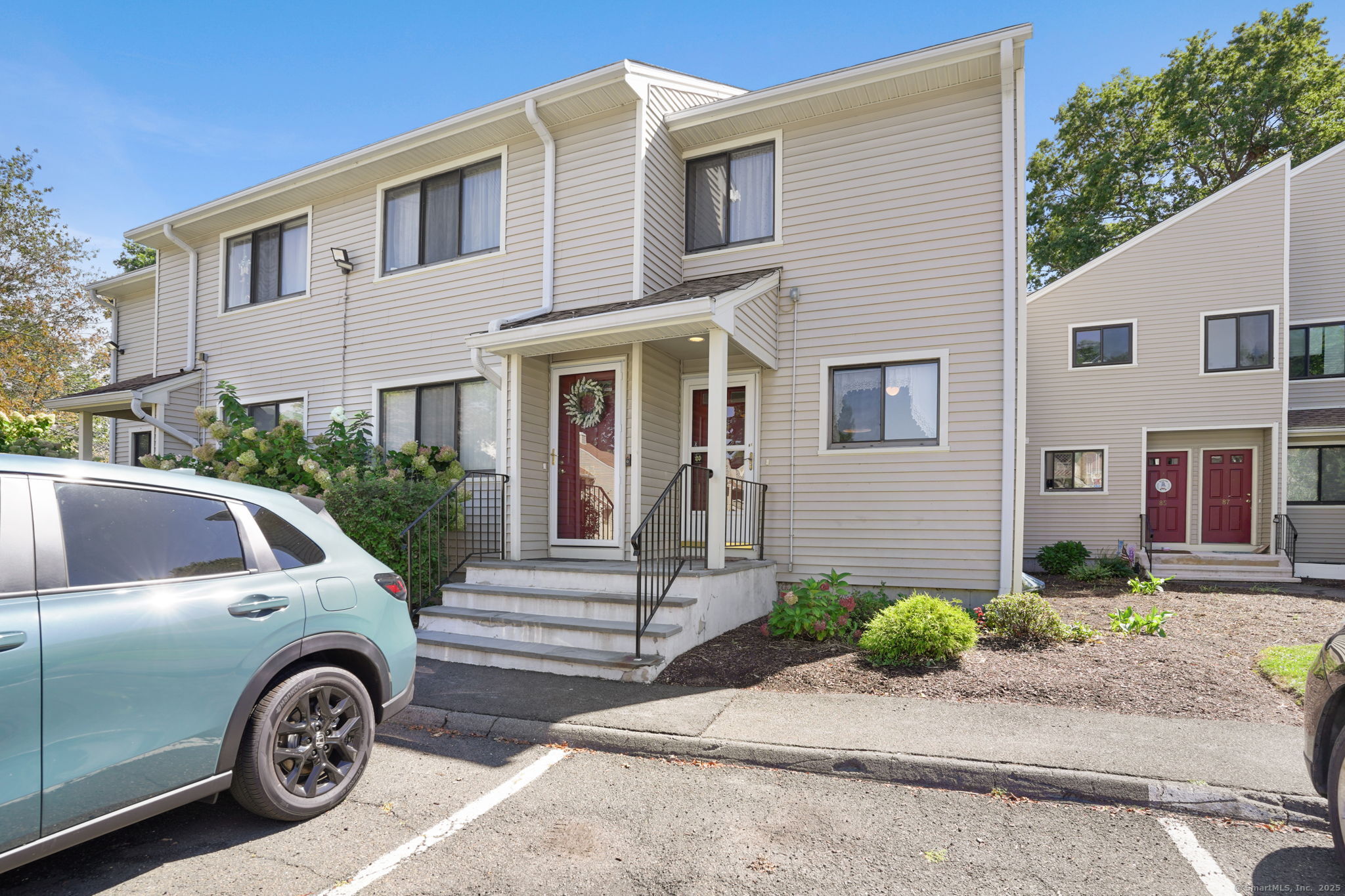 81 Lance Circle, Unit 81 Bridgeport, CT 06606 - Photo 19 of 24 a front view of a house with garden