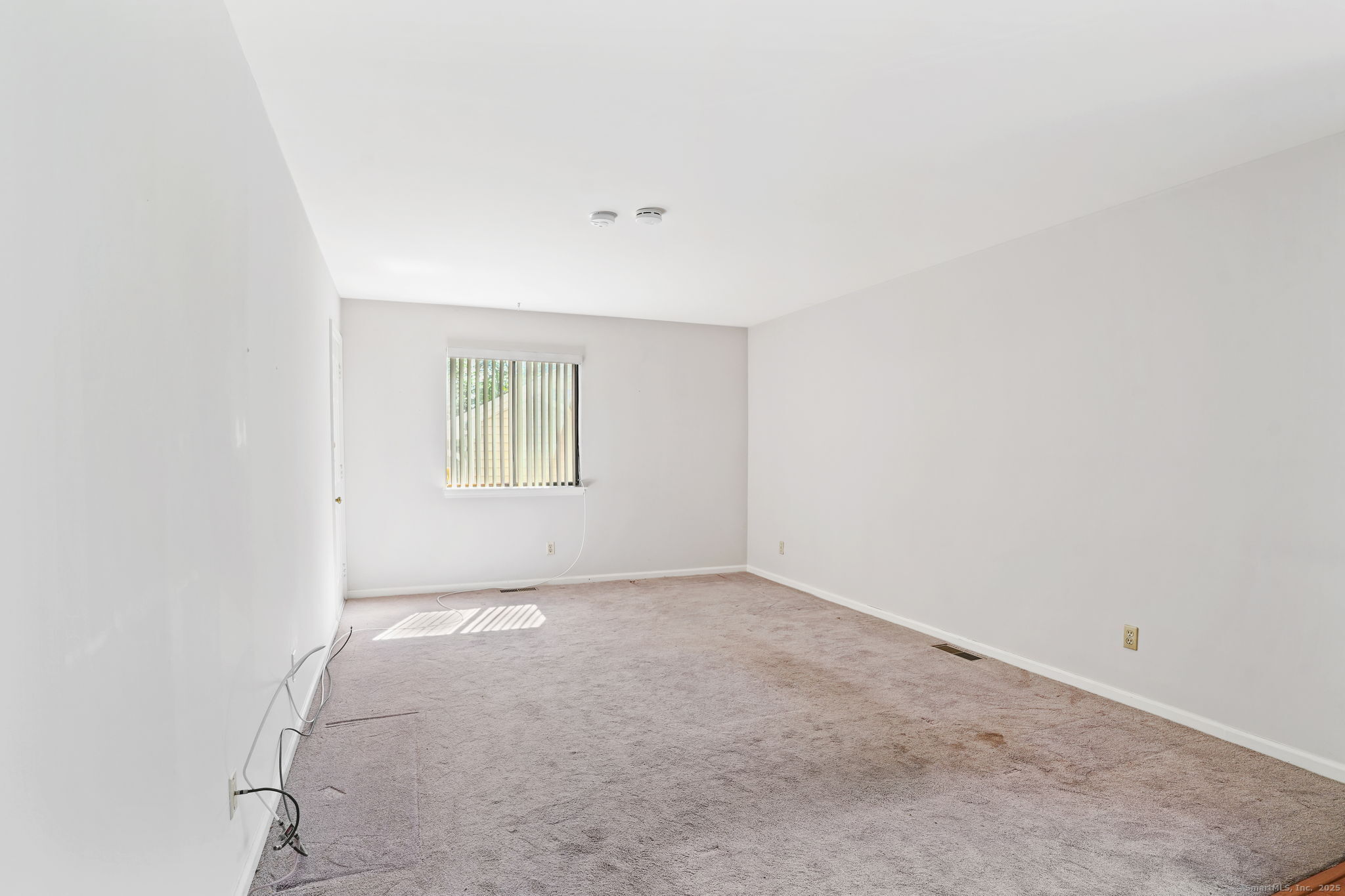 81 Lance Circle, Unit 81 Bridgeport, CT 06606 - Photo 7 of 24 an empty room with windows