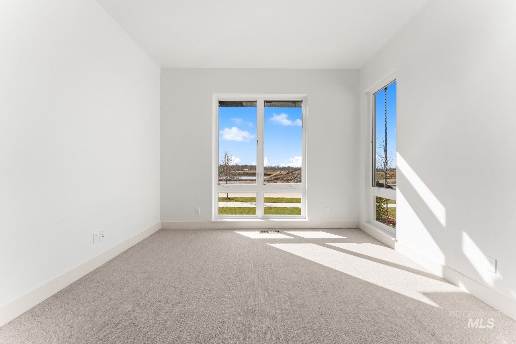6954 Saddle Bred Way Star, ID 83669 - Photo 27 of 49 Empty room with light carpet and baseboards