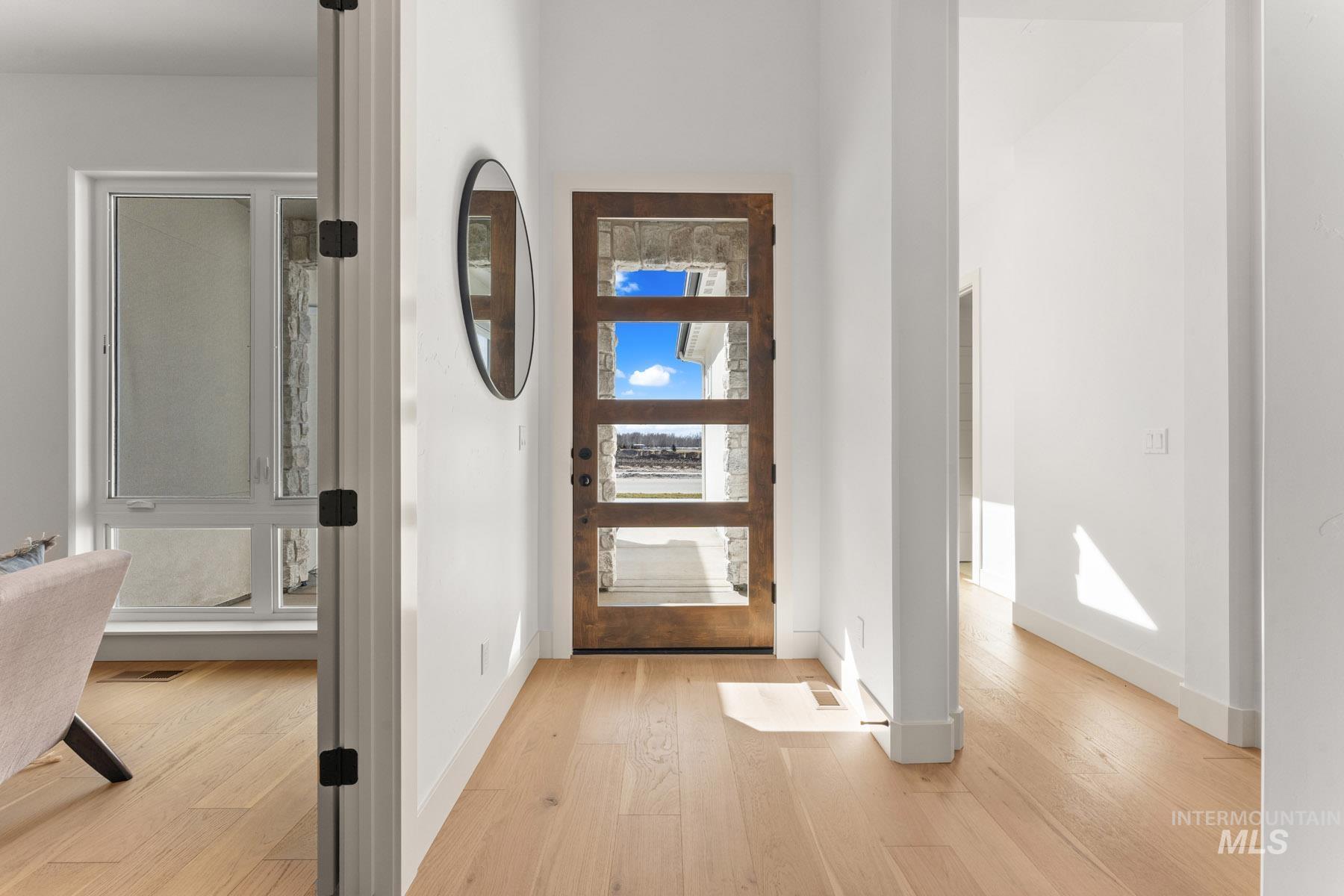 6954 Saddle Bred Way Star, ID 83669 - Photo 32 of 49 Foyer with light wood-style flooring and baseboards