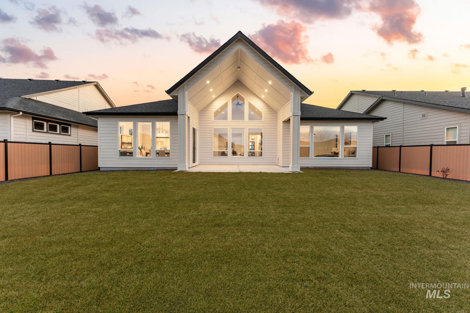 6954 Saddle Bred Way Star, ID 83669 - Photo 37 of 50 Rear view of house with a patio area, a fenced backyard, and roof with shingles