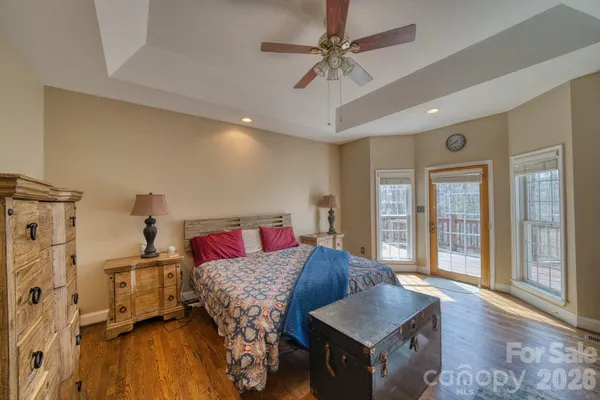 a living room with a bed furniture and a window