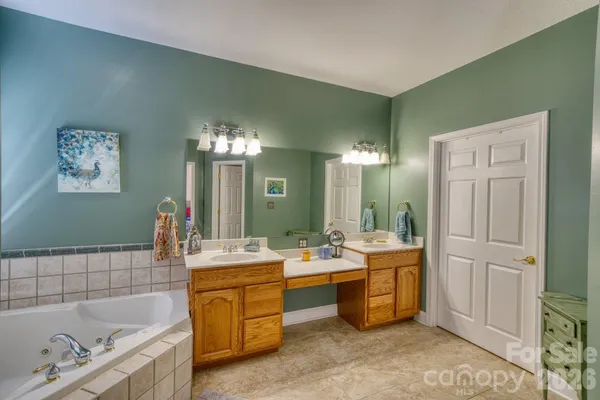 a room with a sink vanity and mirror