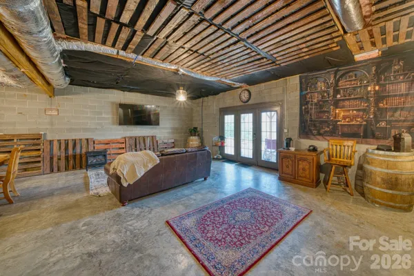 a bed room with furniture and a flat screen tv