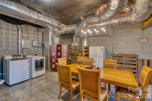 a kitchen with a table chairs and a stove