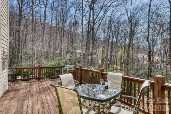 a view of a chairs and table on the deck