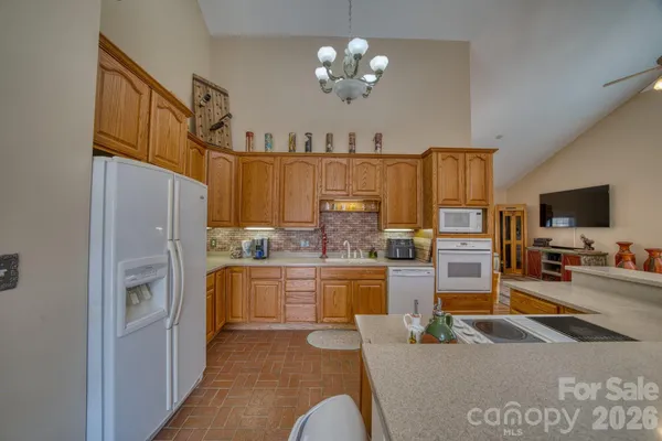 a kitchen with cabinets and window