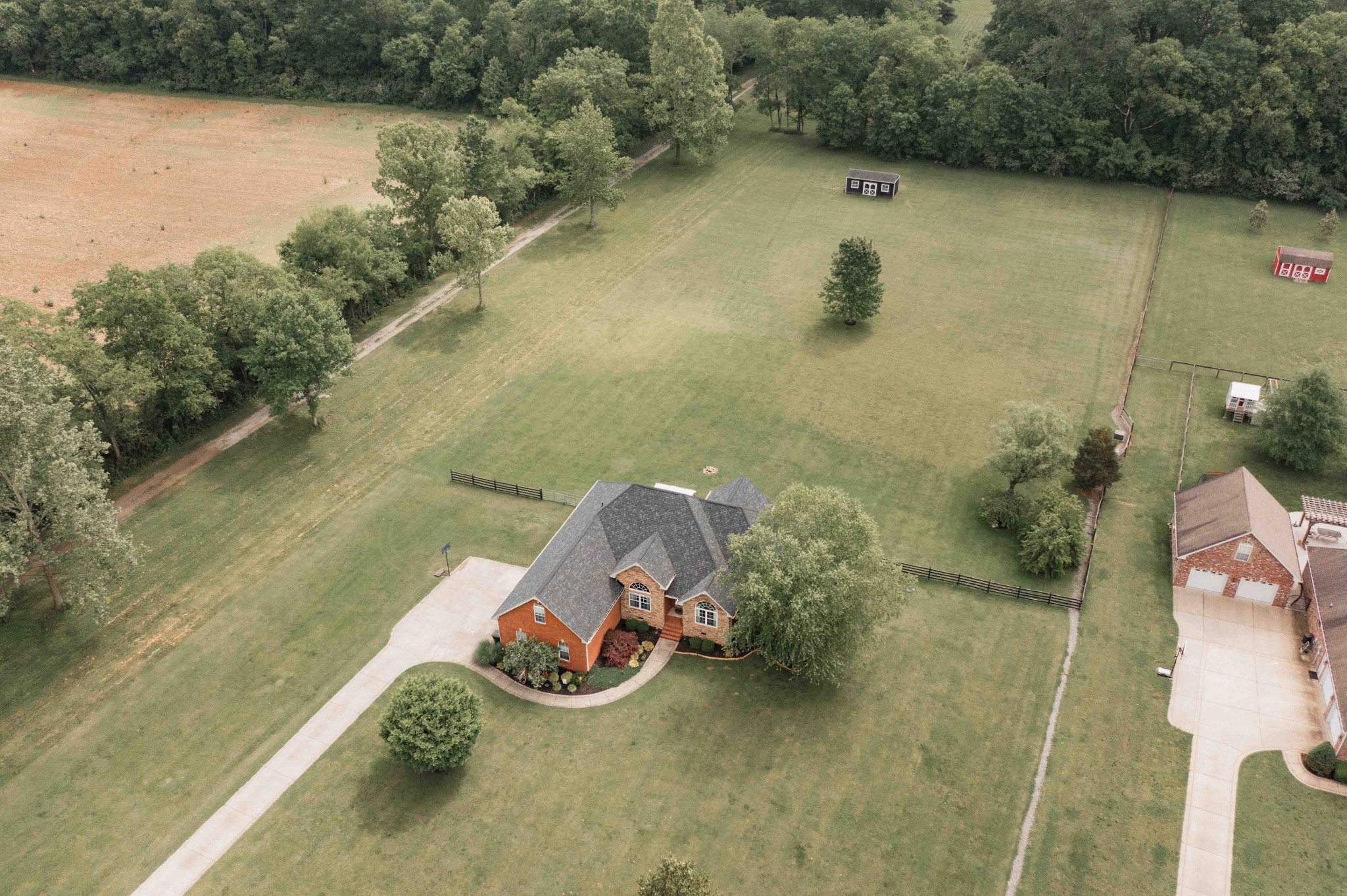 252 County House Hollow Road Cottontown, TN 37048 - Photo 3 of 50 an aerial view of a house with a lake view