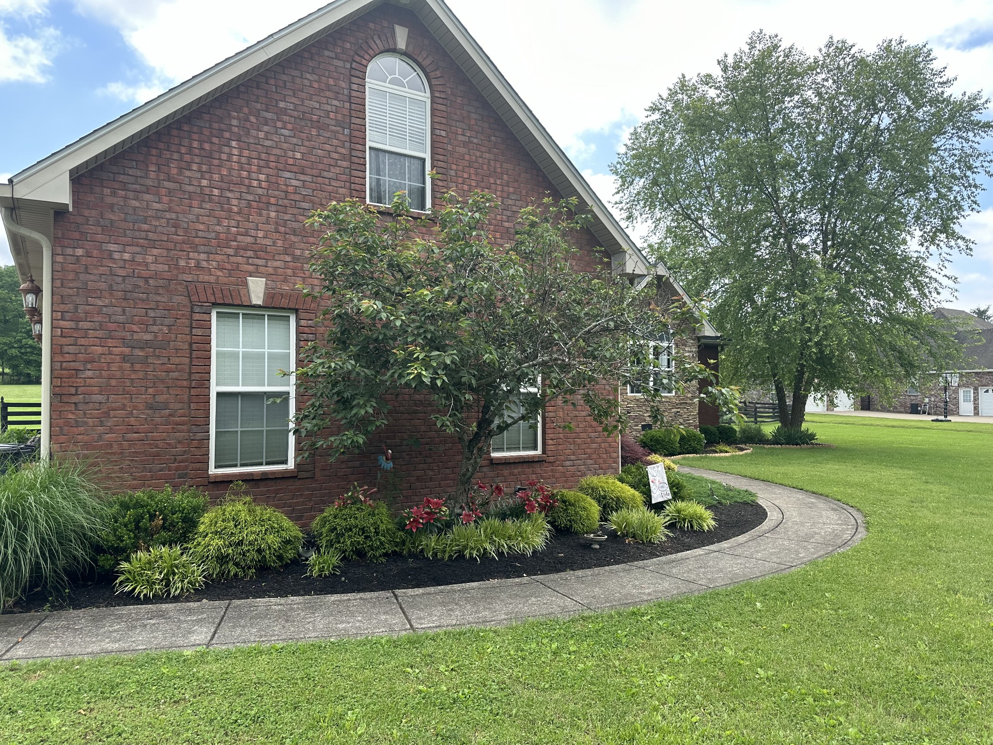 252 County House Hollow Road Cottontown, TN 37048 - Photo 43 of 50 a front view of a house with garden