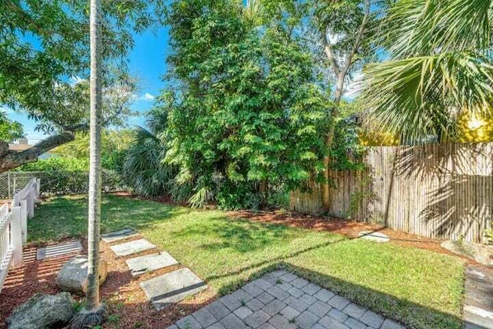 11 Southwest 4th Street Delray Beach, FL 33444 - Photo 20 of 27 a backyard of a house with large trees and plants
