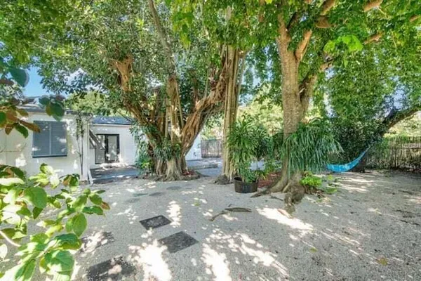a view of a house with a tree