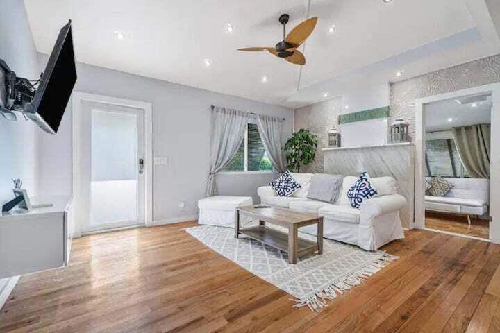 11 Southwest 4th Street Delray Beach, FL 33444 - Photo 4 of 27 a living room with furniture and a flat screen tv