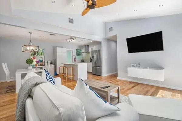 a living room with furniture and a flat screen tv