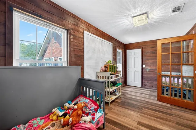 a bedroom with furniture a bed and a window