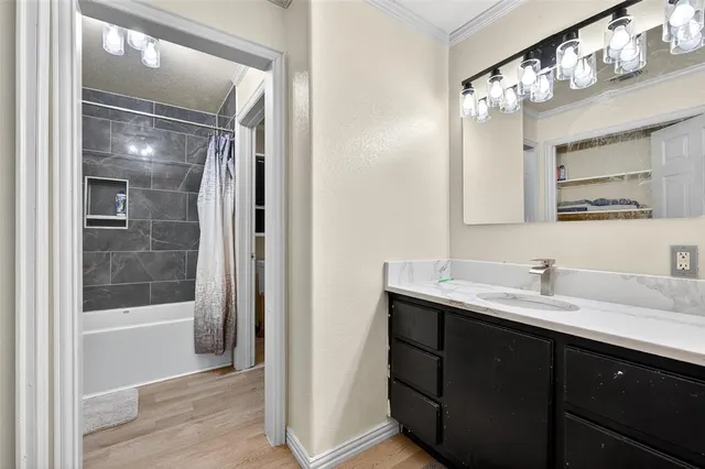 a bathroom with a sink a vanity and a mirror