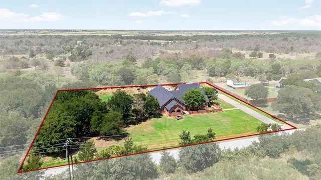 a view of a yard from a balcony