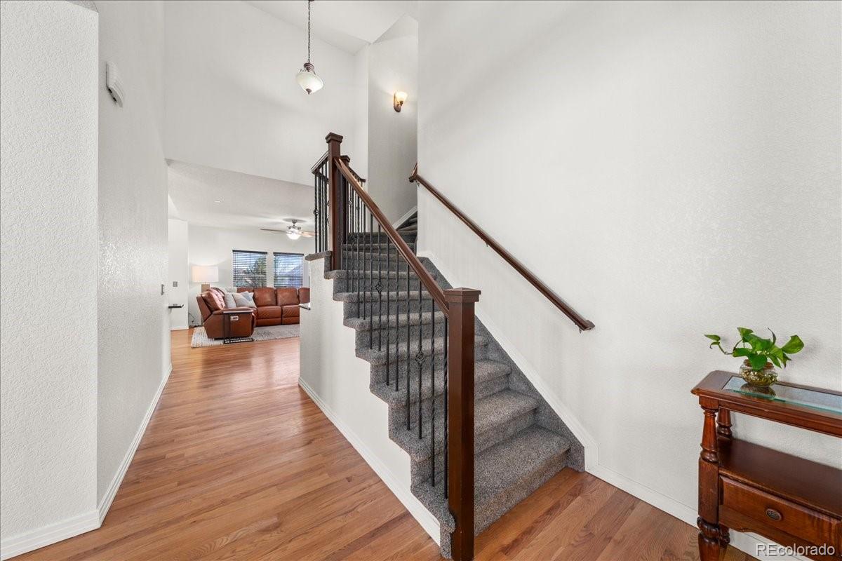 2730 River View Drive Broomfield, CO 80023 - Photo 15 of 48 a view of a hallway with wooden floor and stairs
