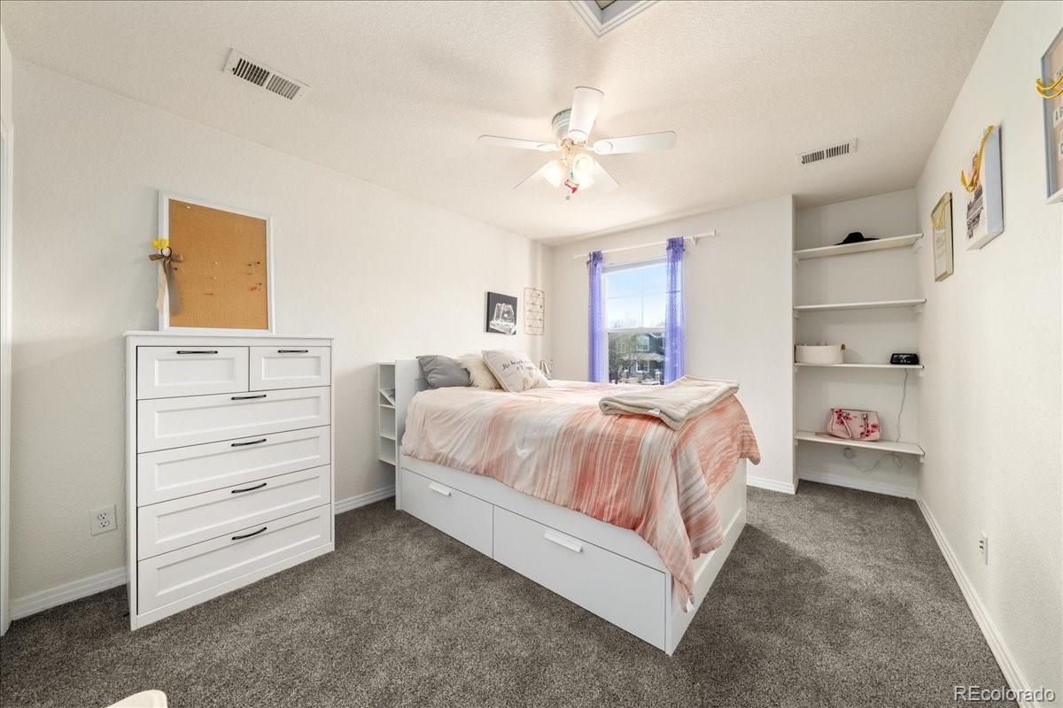 2730 River View Drive Broomfield, CO 80023 - Photo 21 of 48 a spacious bedroom with a bed and a cabinets