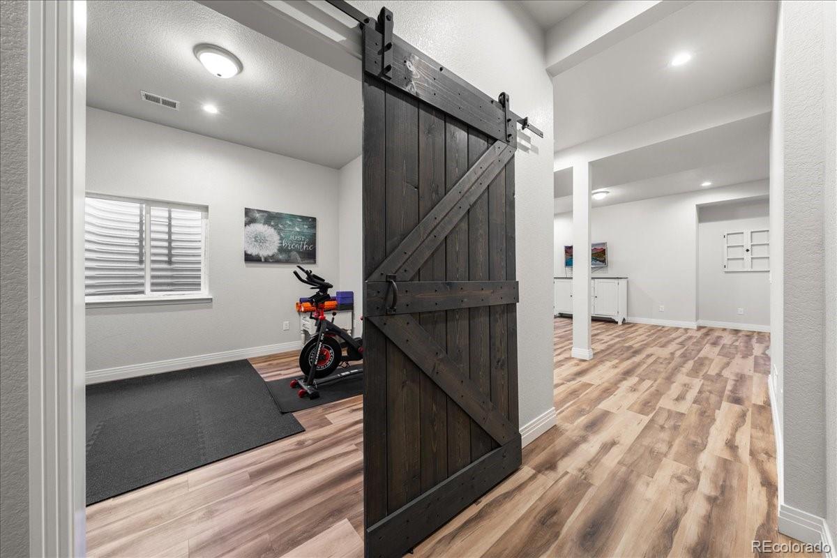 2730 River View Drive Broomfield, CO 80023 - Photo 24 of 48 a view of a hallway with wooden floor and staircase
