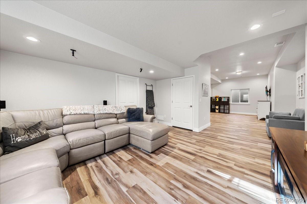 2730 River View Drive Broomfield, CO 80023 - Photo 29 of 48 a living room with furniture and a table