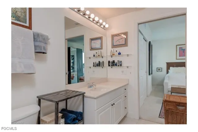 a bathroom with a sink vanity granite and a mirror