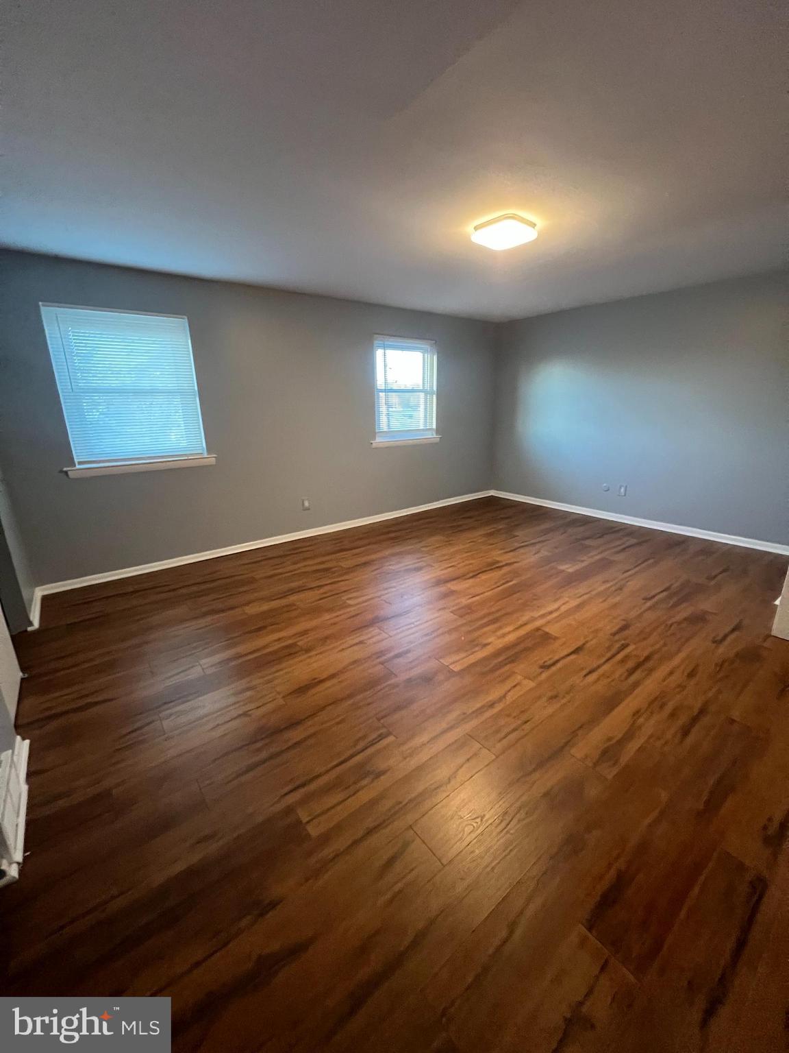 12785 Dunks Ferry Road Philadelphia, PA 19154 - Photo 3 of 12 an empty room with wooden floor and windows