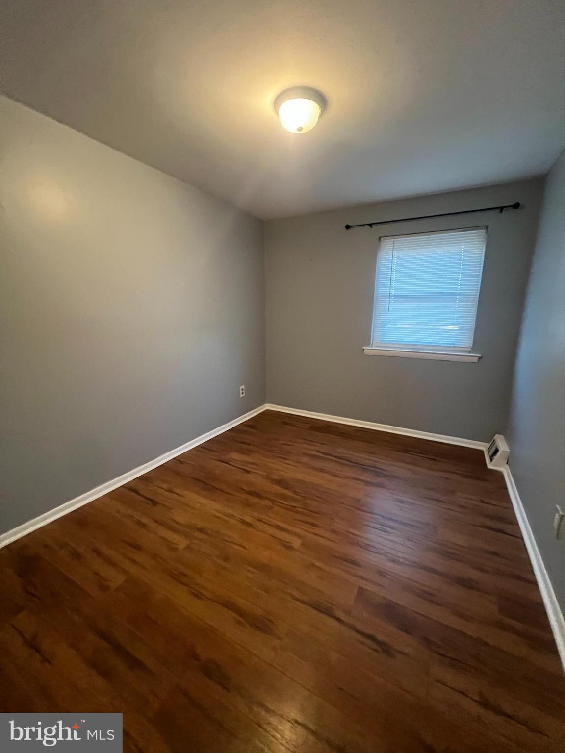 12785 Dunks Ferry Road Philadelphia, PA 19154 - Photo 4 of 12 an empty room with wooden floor and windows