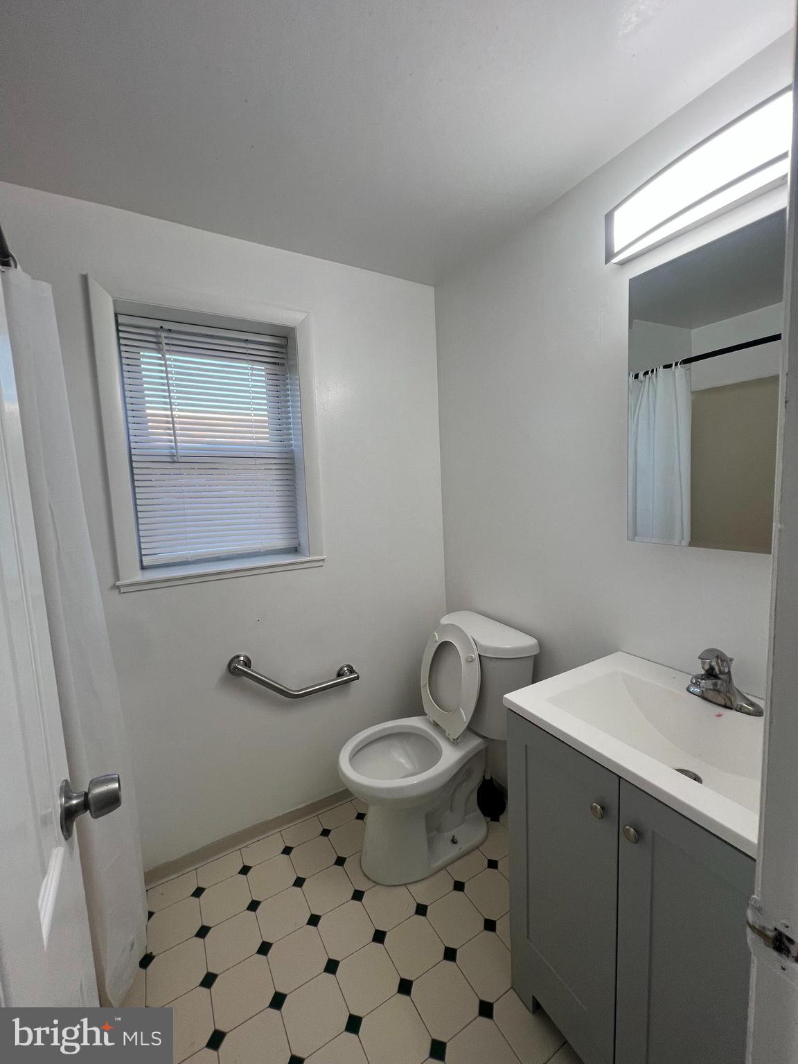 12785 Dunks Ferry Road Philadelphia, PA 19154 - Photo 6 of 12 a bathroom with a sink toilet and mirror