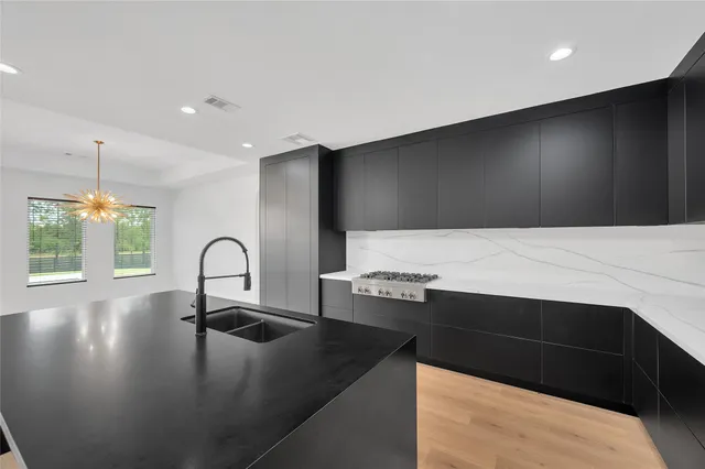 a view of wooden floor and windows in a room