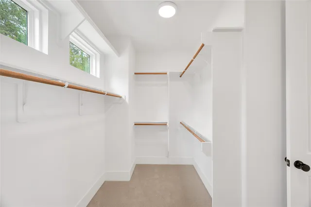 a view of an empty room with windows