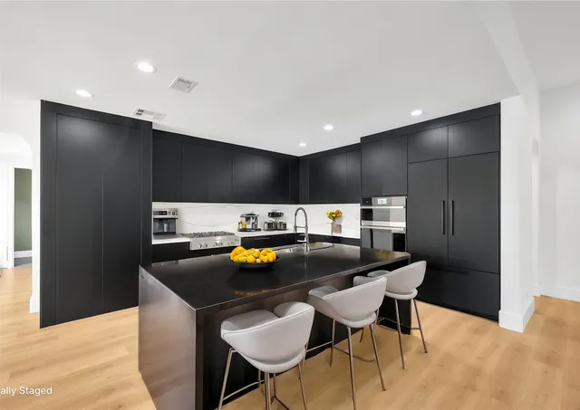 a kitchen with a table and chairs in it