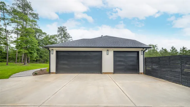 a view of yard with swimming pool and trees in the background