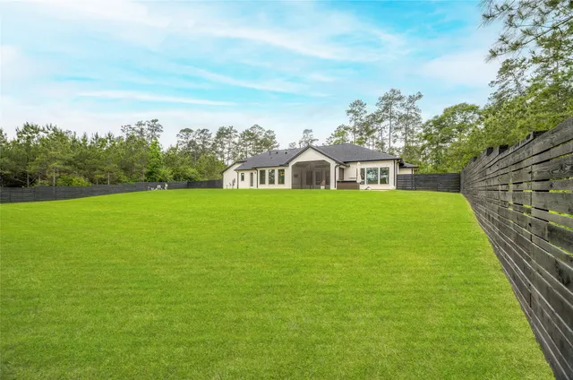 a view of a house with a big yard