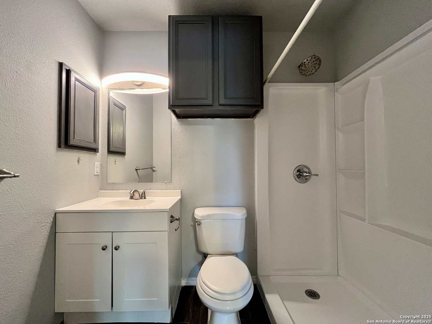 5019 Ed White Street Kirby, TX 78219 - Photo 11 of 15 a bathroom with a toilet sink and shower