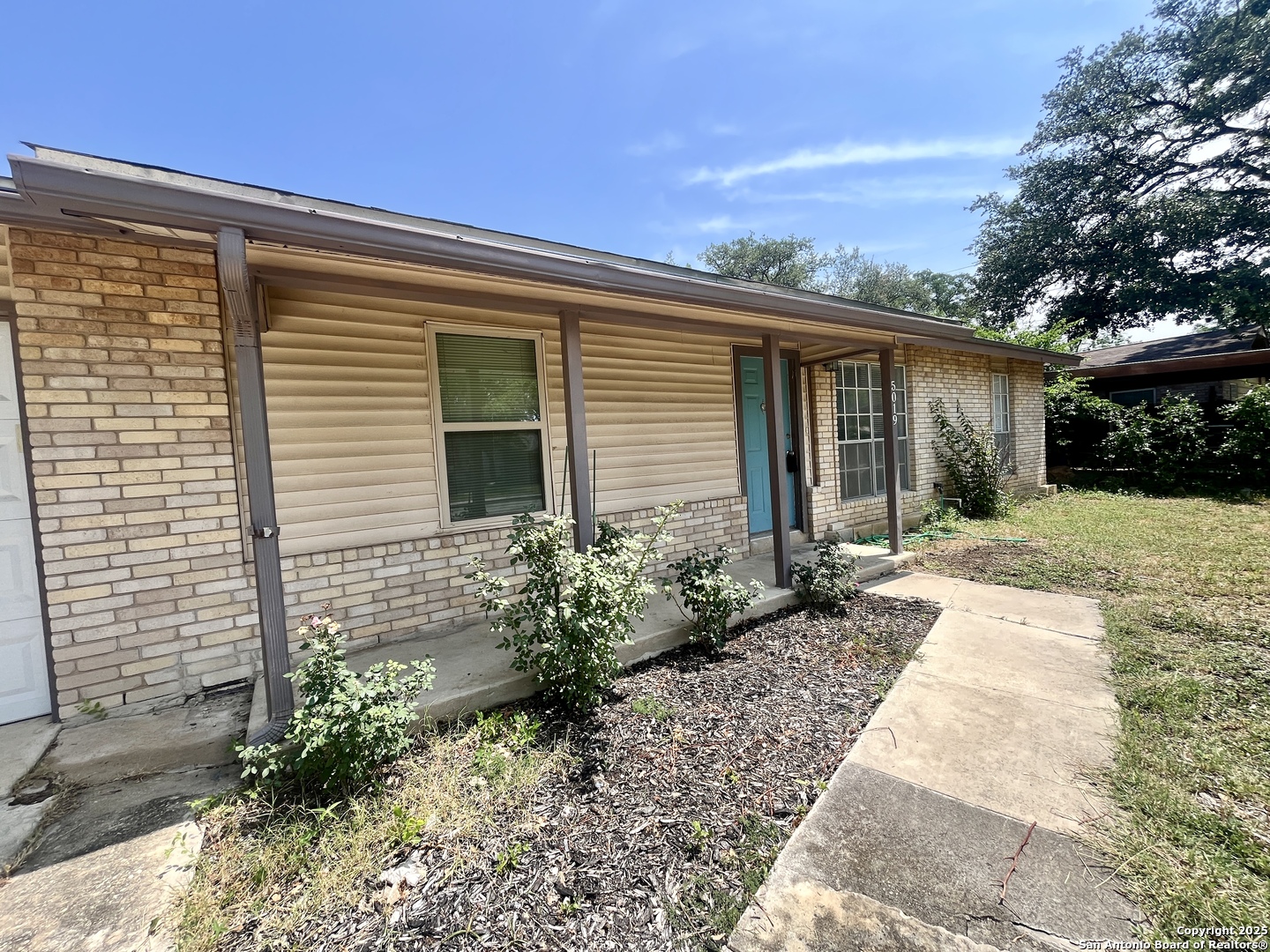 5019 Ed White Street Kirby, TX 78219 - Photo 12 of 15 a front view of a house with garden