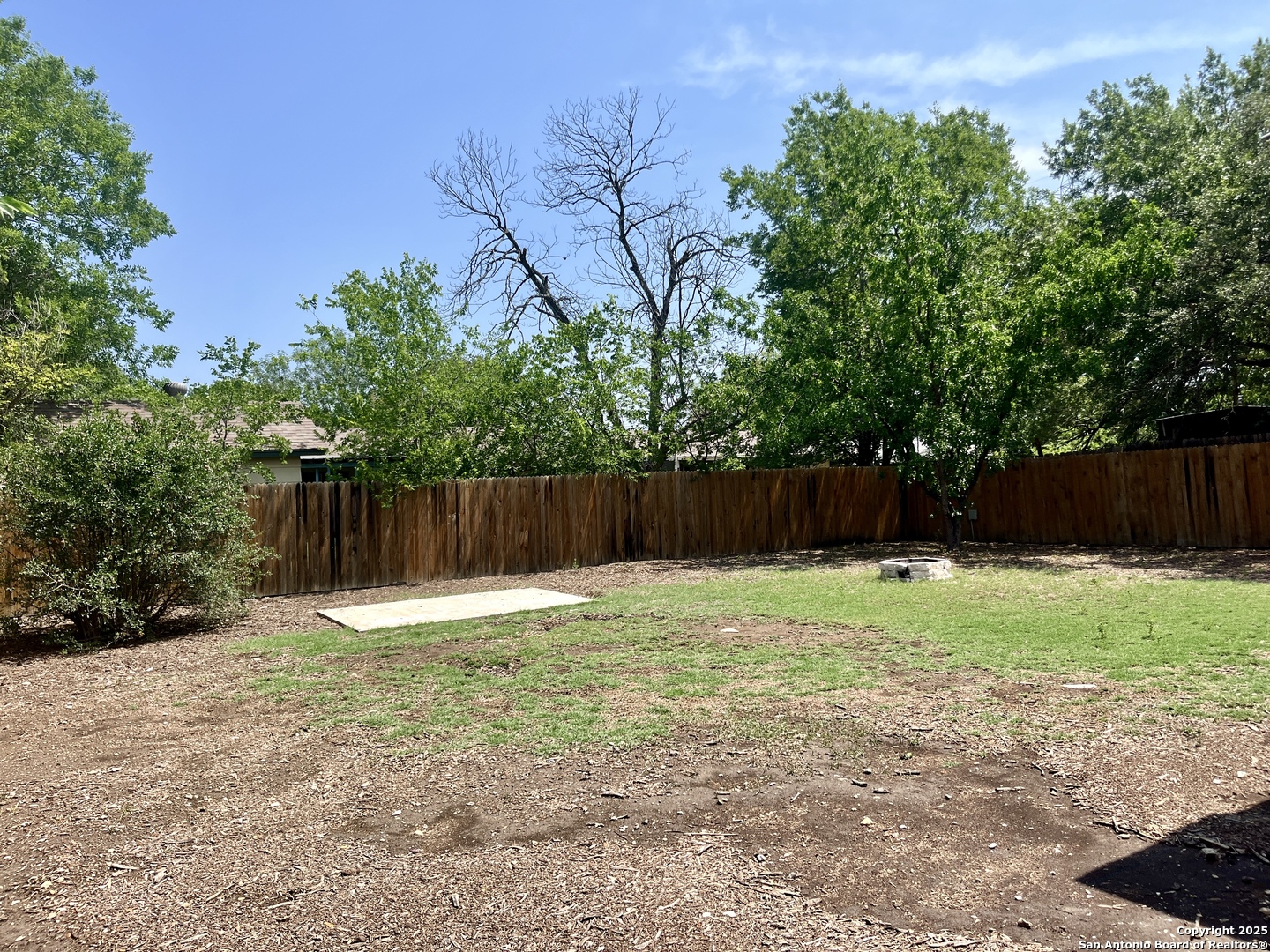 5019 Ed White Street Kirby, TX 78219 - Photo 15 of 15 a backyard of a house