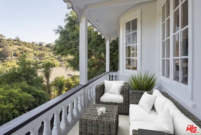 a view of balcony with couches