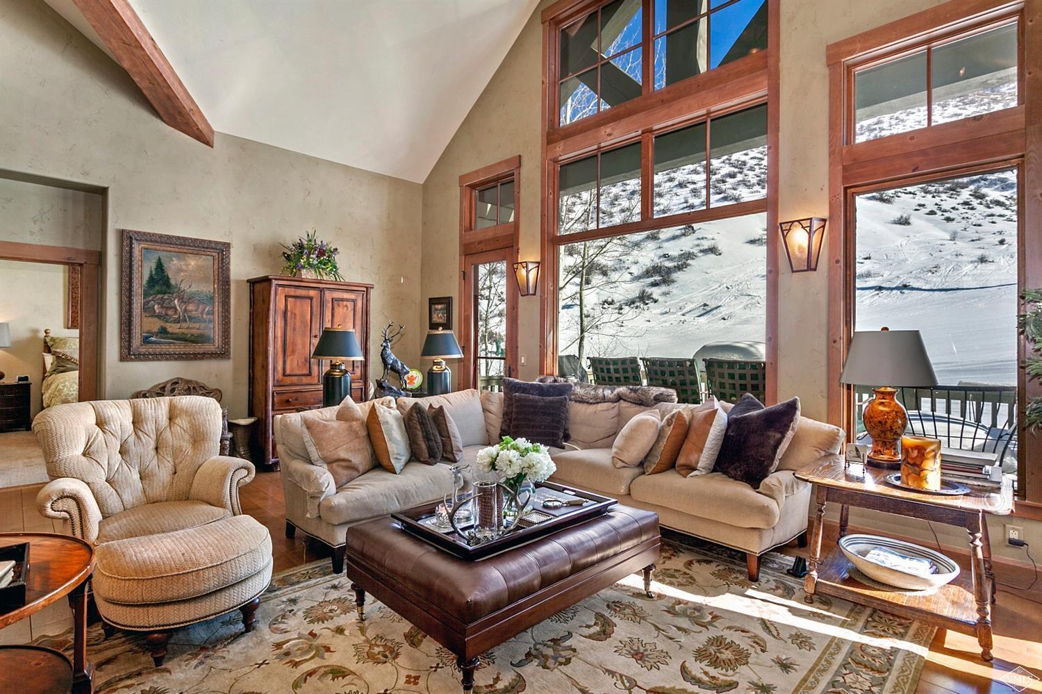 348 Cresta Road Edwards, CO 81632 - Photo 6 of 25 a living room with furniture a rug and a large window
