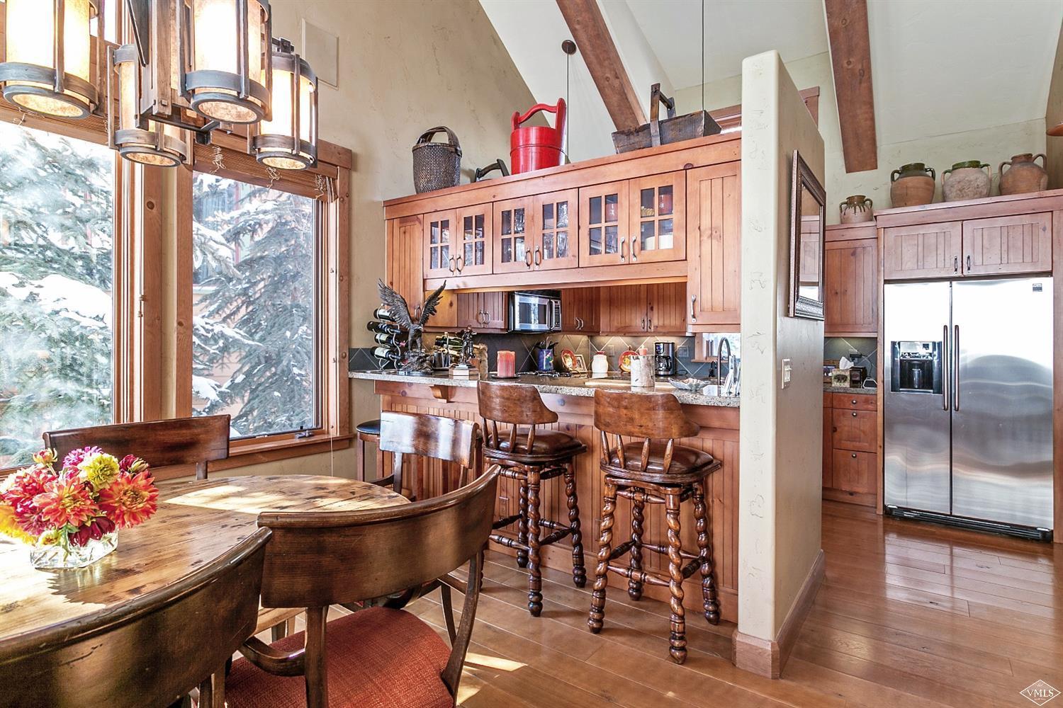 348 Cresta Road Edwards, CO 81632 - Photo 8 of 25 a view of a dining room with furniture and a window