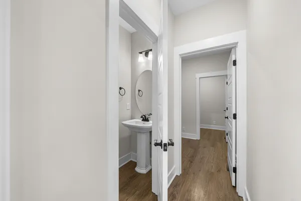 wooden floor with white walls