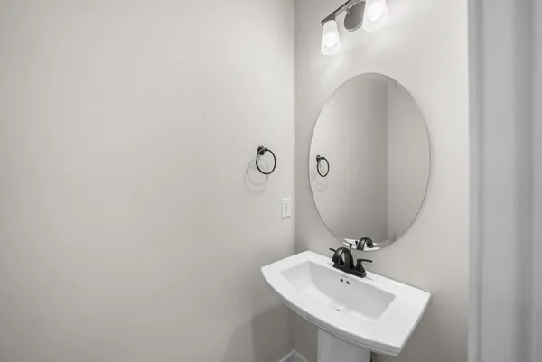 a bathroom with a sink and mirror