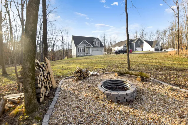 a view of a swimming pool with a yard
