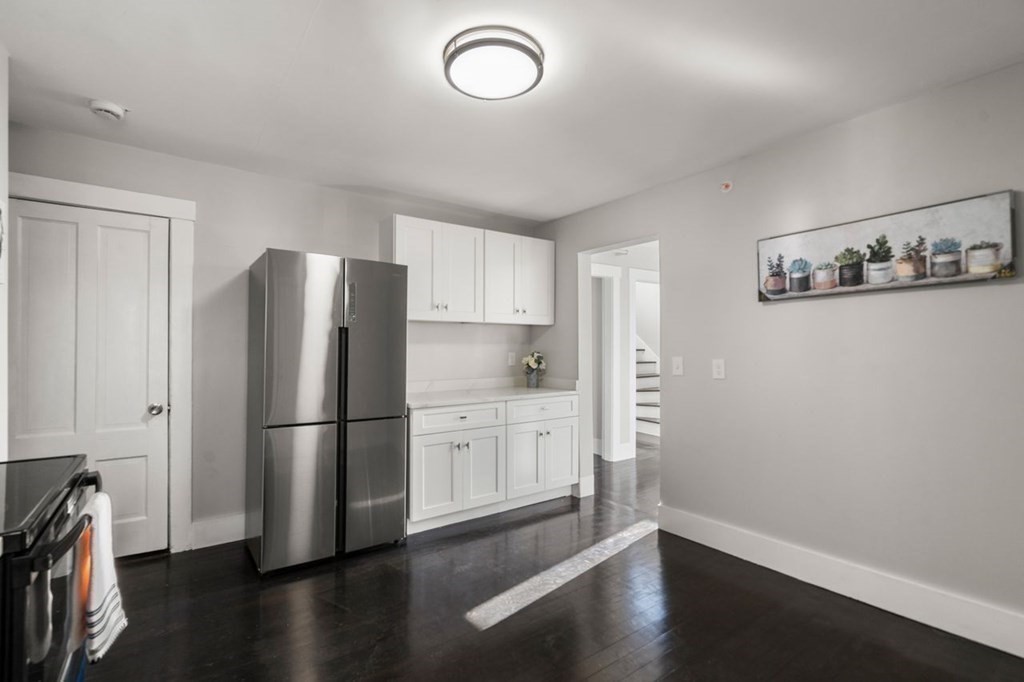 35-41 Watch Street Rochdale, MA 01542 - Photo 18 of 42 a kitchen with a refrigerator and a stove top oven