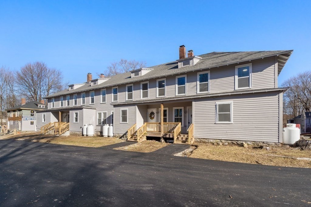 35-41 Watch Street Rochdale, MA 01542 - Photo 2 of 42 a view of a house with a patio