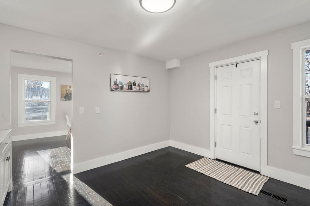 35-41 Watch Street Rochdale, MA 01542 - Photo 21 of 42 a view of an empty room with wooden floor and a window