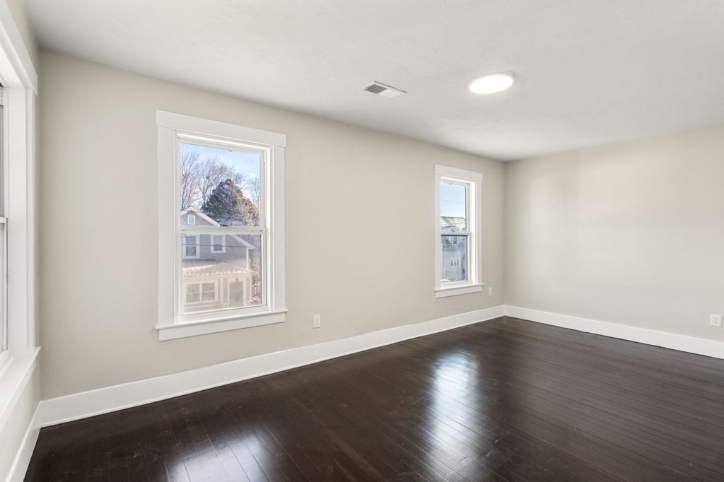 35-41 Watch Street Rochdale, MA 01542 - Photo 29 of 42 a view of an empty room with wooden floor and a window