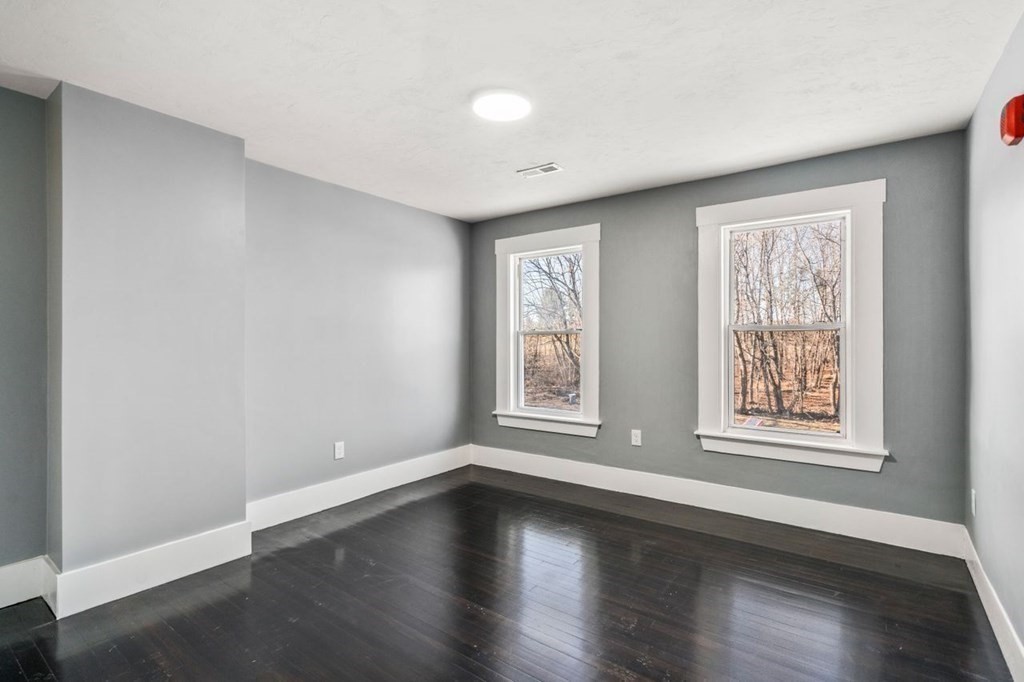 35-41 Watch Street Rochdale, MA 01542 - Photo 34 of 42 a view of an empty room with wooden floor and window